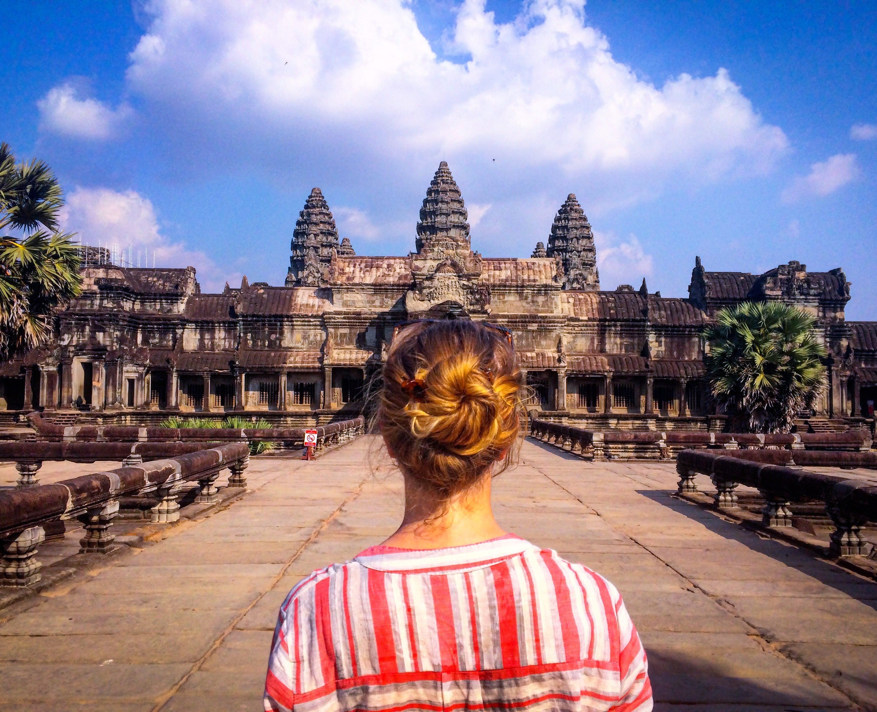 female traveler gazing at ancient building