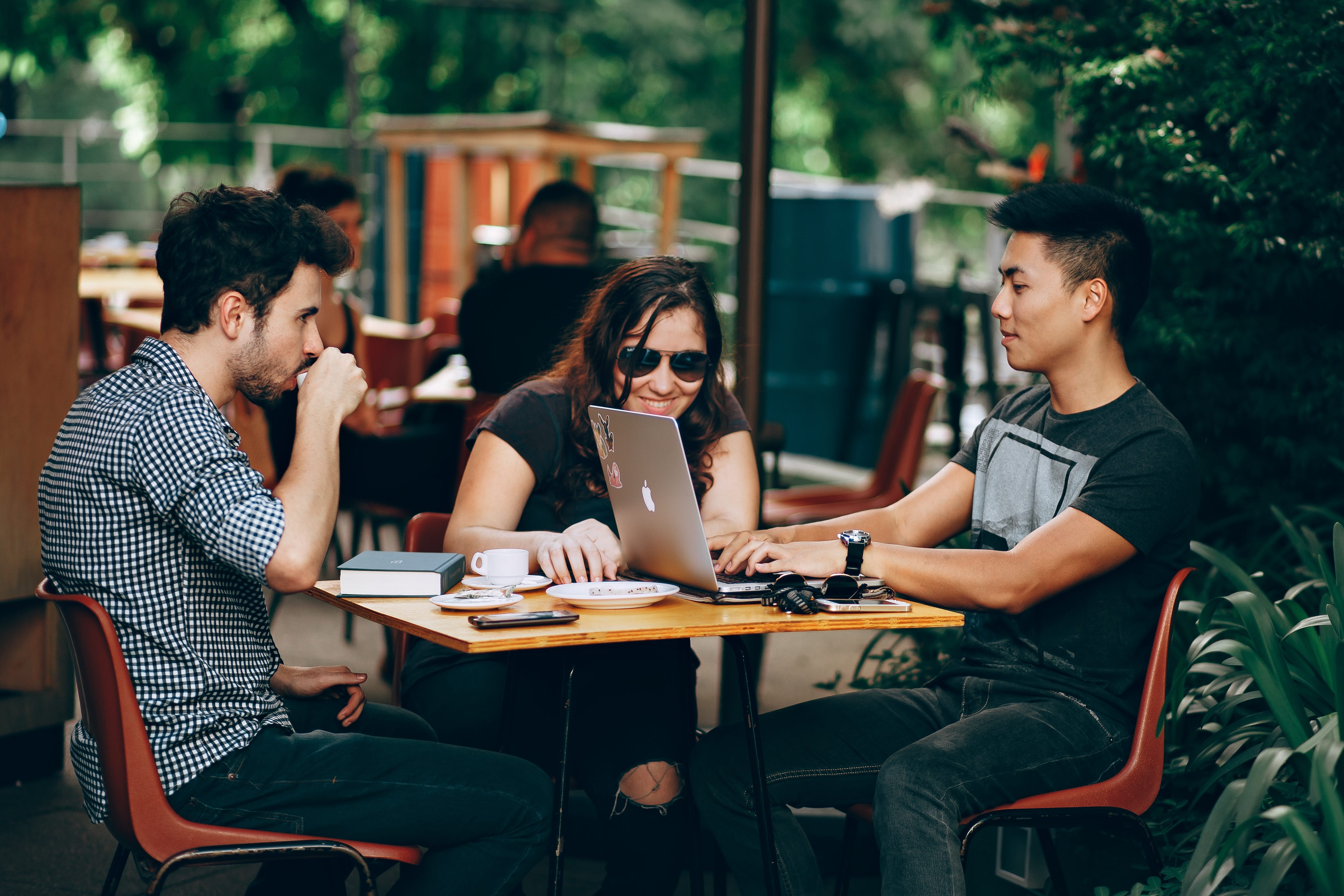 group collaborating at outdoor cafe