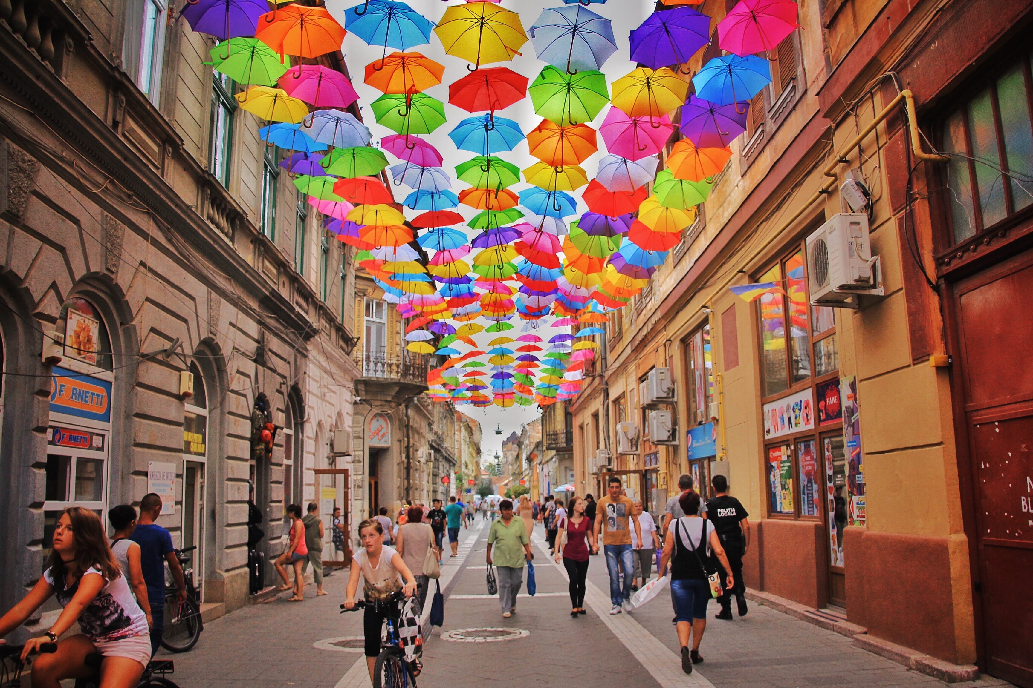 romania - colorful umbrellas above city street