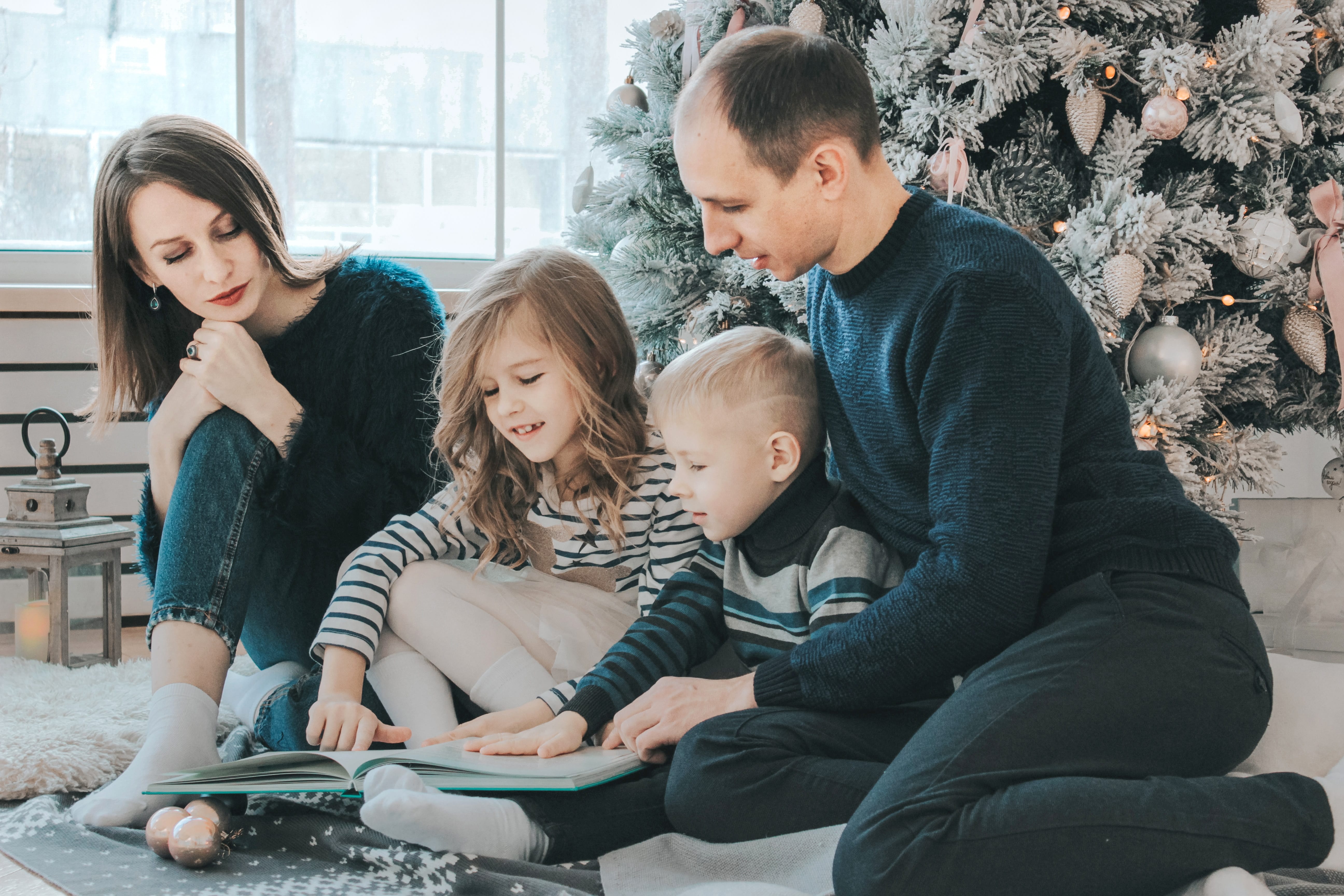 parents and children reading on Christmas morning