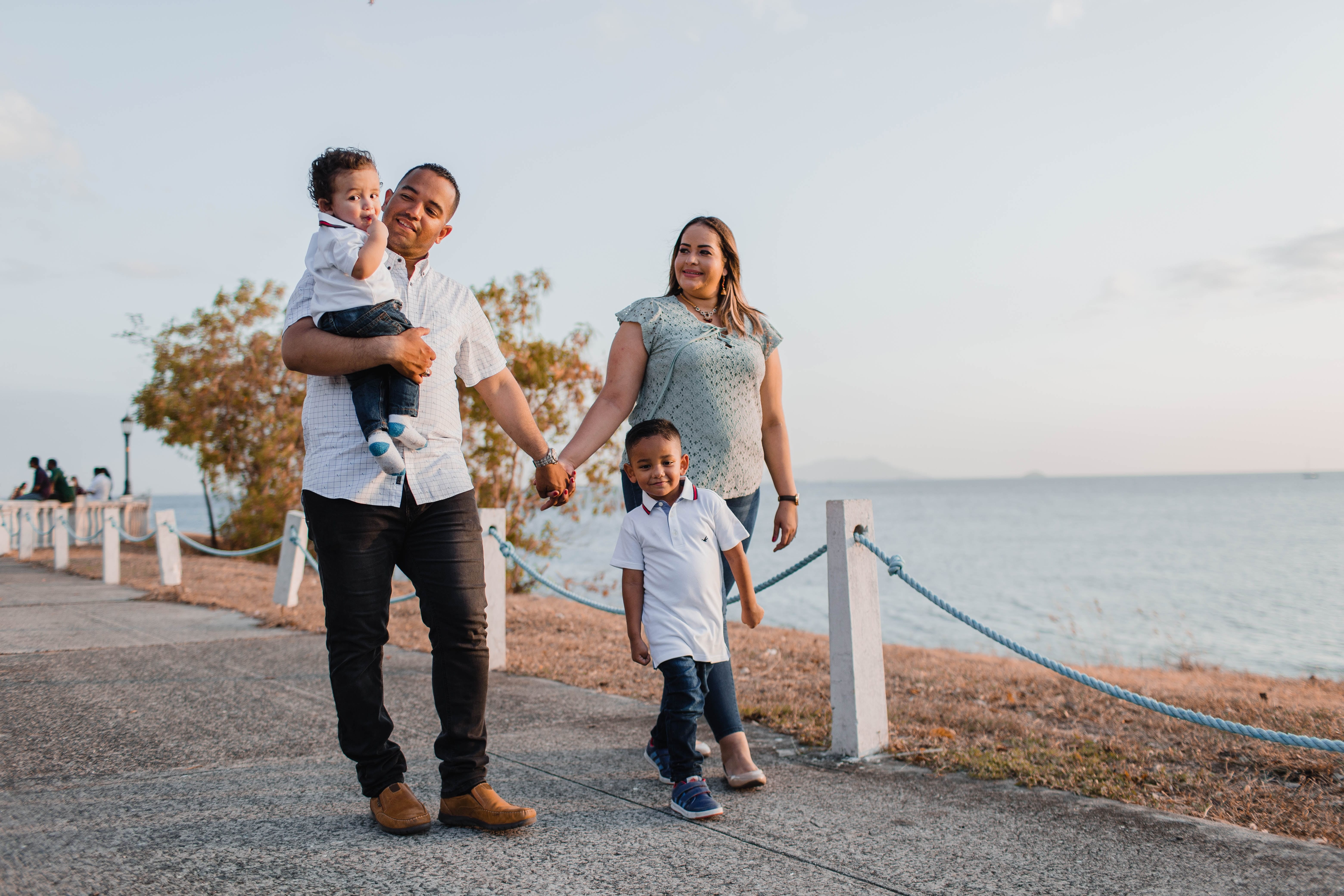 family walking near ocean